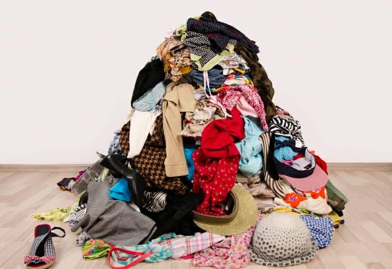 Pile of clothing on the floor - how to be ruthless when decluttering clothes