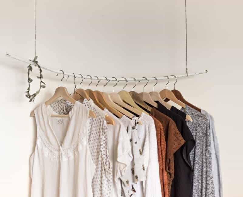 Overwhelmed by laundry: clothes hanging in closet