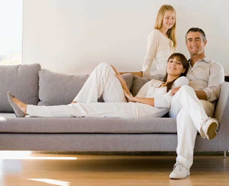 Extreme minimalism: family relaxing on couch